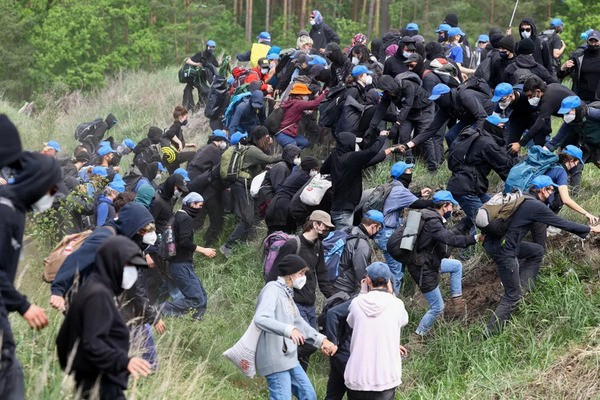 Protesters make an effort to breach Germany's Tesla factory.