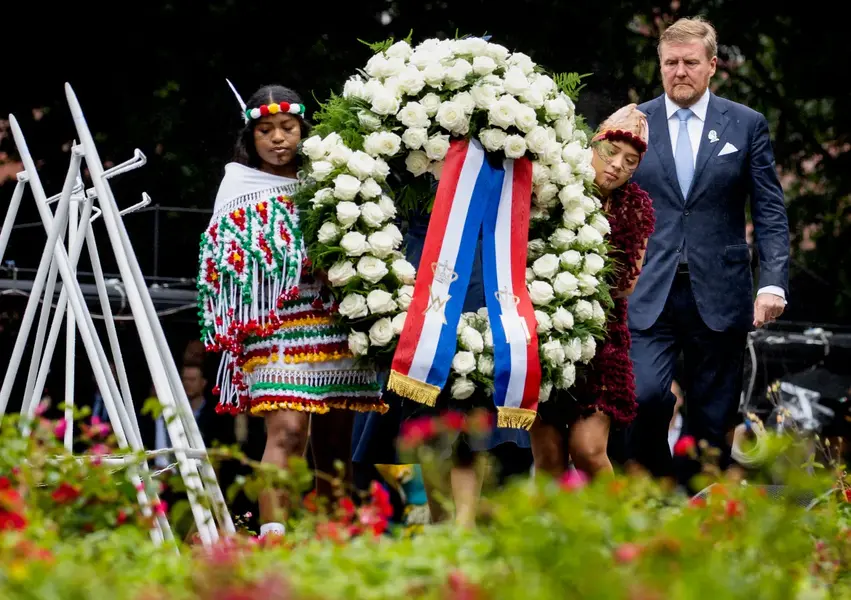 Dutch King Willem-Alexander laid a wreath at the slavery monument after apologising for the royal house's role in slavery and asked forgiveness in a speech greeted by cheers and whoops at an event to commemorate the anniversary of the country abolishing slavery in Amsterdam, Netherlands, July 1. [Remko de Waal/Pool via AP Photo]