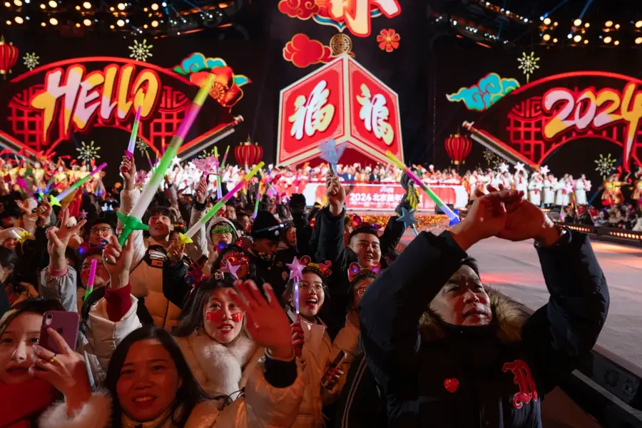 Revellers ring in the new year in Beijing [Ng Han Guan/AP Photo]