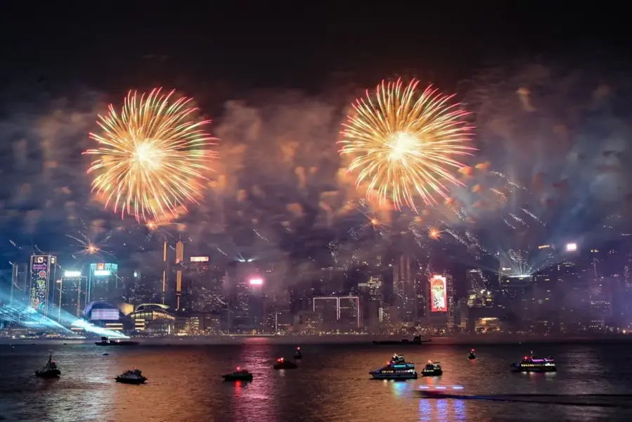 Fireworks explode over Victoria Harbour to celebrate the New Year in Hong Kong [Peter Parks/AFP]