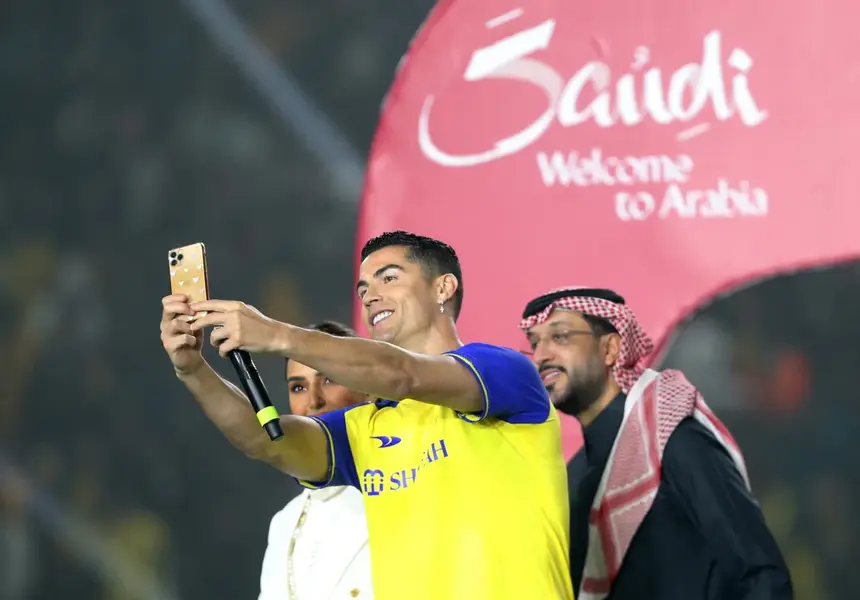 Cristiano Ronaldo takes a selfie during his presentation at Al Nassr football club on January 3, in Riyadh, Saudi Arabia. He became the world’s highest-paid athlete for the first time since 2017 after his move to Al Nassr, with an estimated $260m income in 2023. 