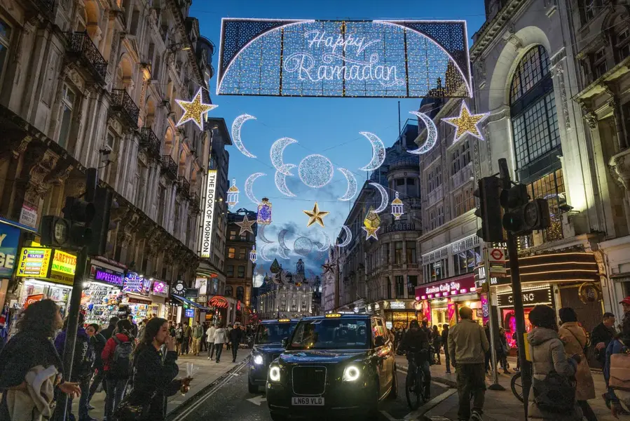 The first-ever Ramadan lights installation at Piccadilly Circus lit up the eve of the first day of Ramadan, in London, UK, March 21. [Anna Gordon/Reuters]