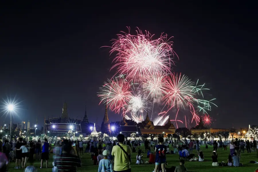 Fireworks light the sky over the Grand Palace during New Year celebrations in Bangkok, Thailand [Athit Perawongmetha/Reuters]