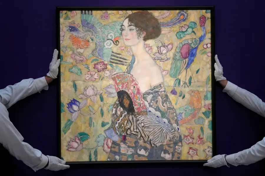 Gustav Klimt's, Dame mit Faecher (Lady with a Fan), is displayed at Sotheby's auction rooms in London, June 20. A late-life masterpiece by the Austrian artist sold for 85.3 million pounds ($108.4m), making it the most expensive artwork ever auctioned in Europe. [Kirsty Wigglesworth/AP Photo]