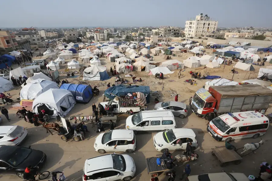 A general view shows Palestinian residents in their makeshift tents after leaving their homes in the Bureij refugee camp in Deir el-Balah, central Gaza. [Ashraf Amra/Anadolu]
