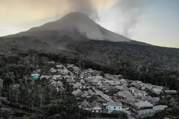 An aerial view of houses covered with volcanic ash following the eruption of Mount Merapi volcano in Magelang, Central Java province, Indonesia, on March 13, 2023. [Antara Foto/Hendra Nurdiyansyah/via Reuters]
